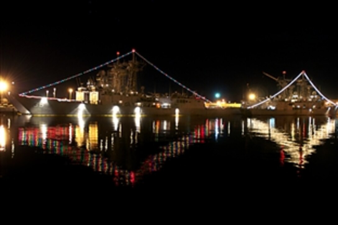 The guided-missile frigates USS Underwood and USS Halyburton are decorated with lights for a holiday lighting contest at Naval Station Mayport, Fla., Dec. 15, 2010.