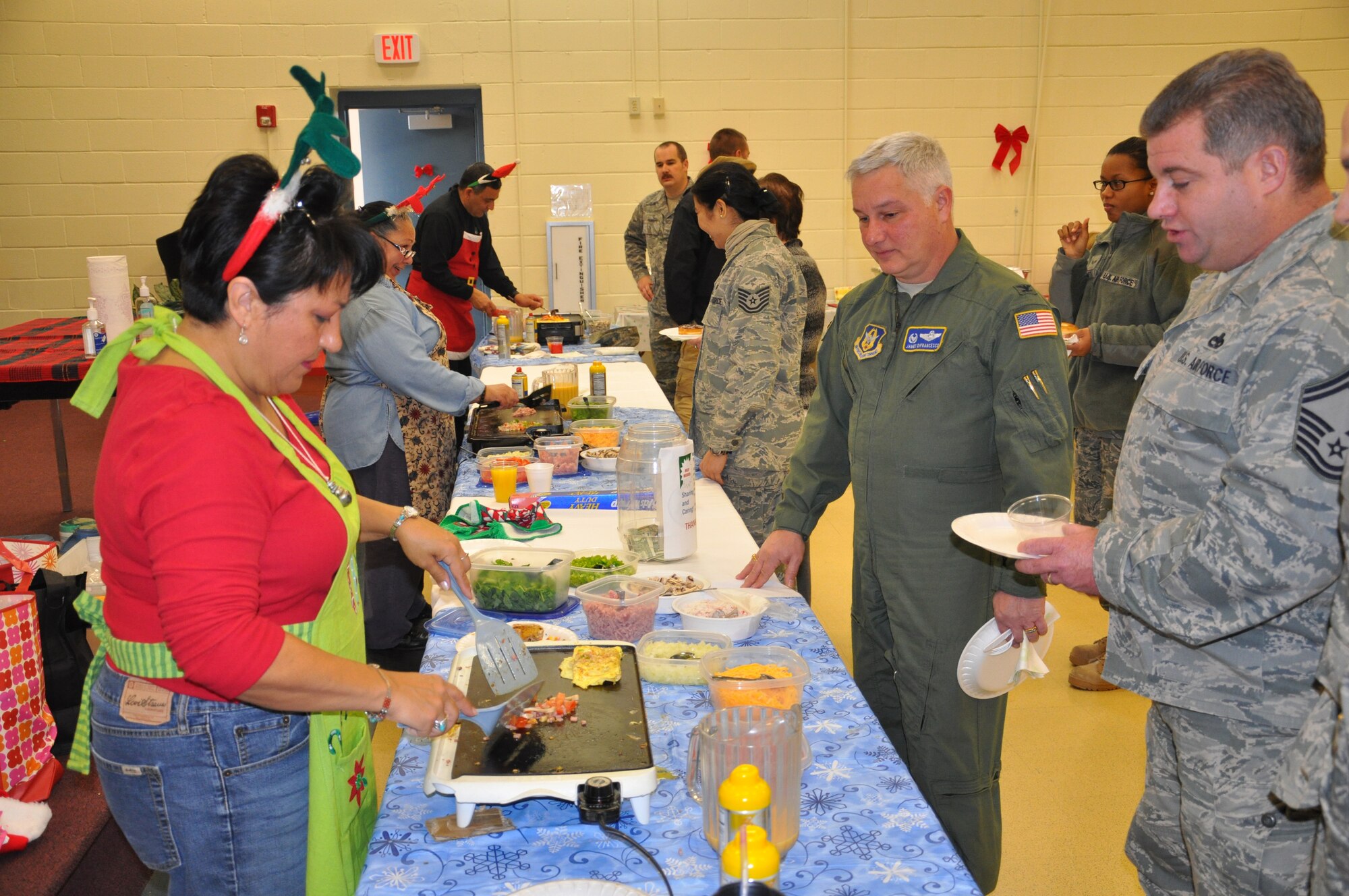 JOINT BASE MCGUIRE-DIX-LAKEHURST, N.J. -- Members of the 514th Air Mobility Wing attend the 22nd annual holiday breakfast held Dec. 16, here. Participants enjoyed made-to-order omelets and a variety of other items. (U.S. Air Force photo/Master Sgt. Travon W. Dennis)