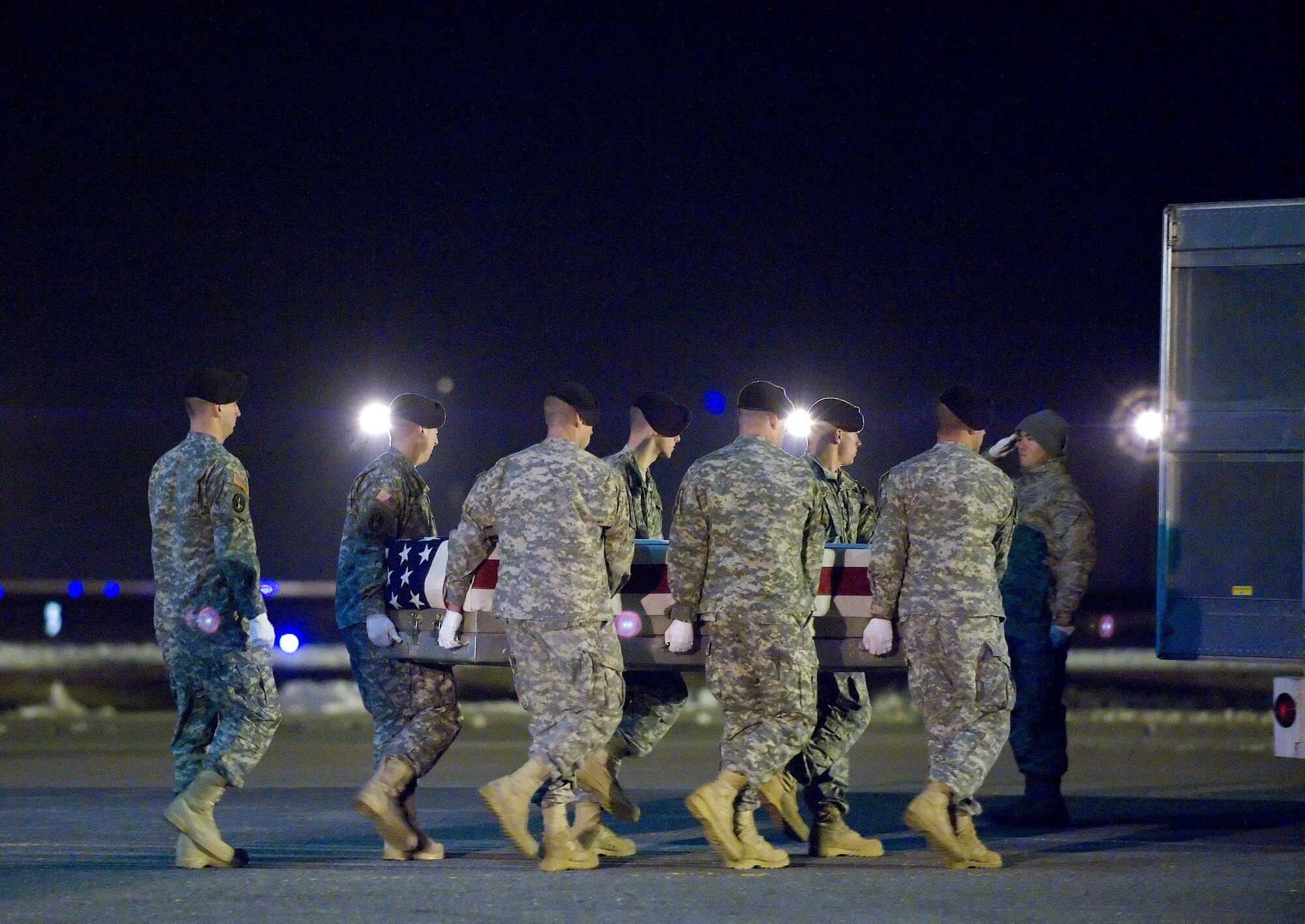 A U.S. Army carry team transfers the remains of Army Spc. Sean R. Cutsforth of Radford, Va., at Dover Air Force Base, Del., Dec. 18, 2010.  Cutsforth was assigned to 3rd Battalion, 187th Infantry Regiment, 3rd Brigade Combat Team, 101st Airborne Division (Air Assault), Fort Campbell, Ky. (U.S. Air Force photo by Jason Minto)