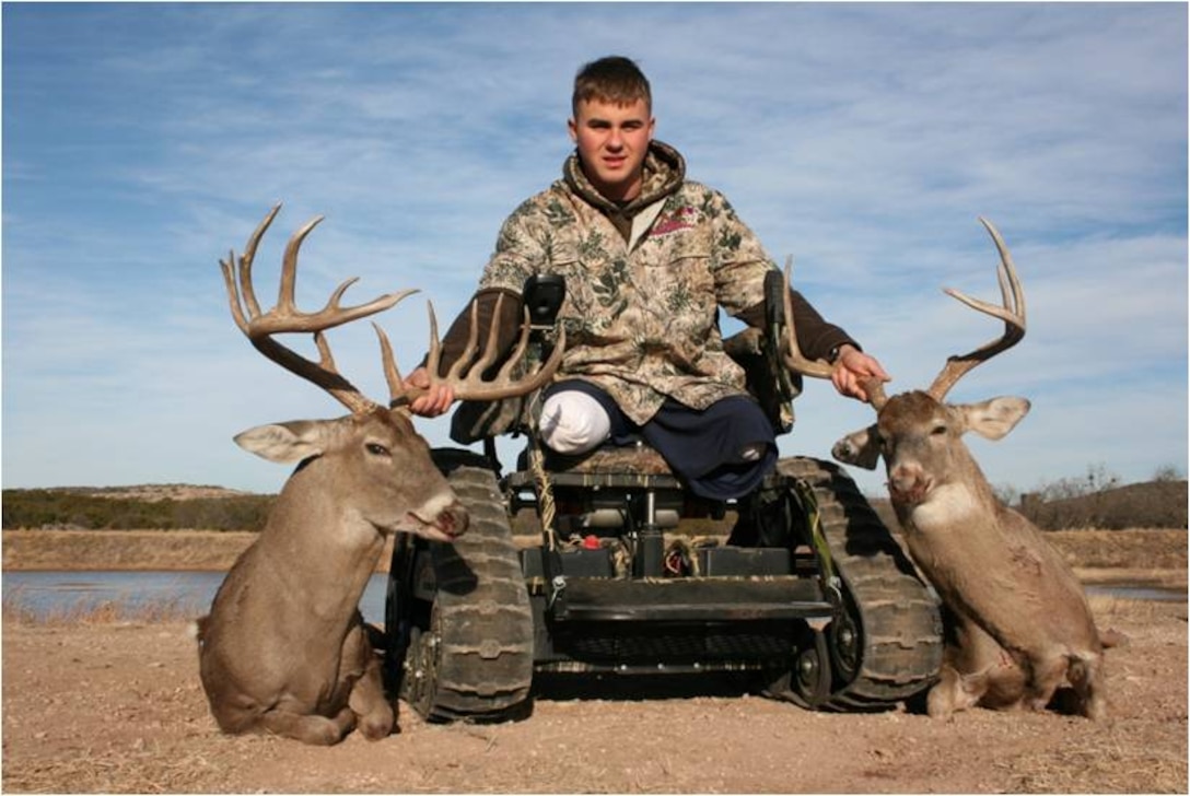 Lance Cpl. Ron Sullivan, bi-lateral above-knee amputee, poses with two Whitetail bucks he shot while hunting on Dos Hermanos Ranch here.  Sullivan is currently assigned to Wounded Warrior Battalion East, Marine Detachment- Brooke Army Medical Center.  The hunt was made possible by Combat Marine Outdoors, a non-profit organization with a mission to provide Dream Hunts and Outdoor Adventures for severely wounded Marines, Soldiers, Airmen, Sailors and Navy Corpsmen, according to the organization's website.  The three-day event provided Sullivan and other wounded Marines and Marine veterans an opportunity to focus on their abilities and enjoy the hunting experience.