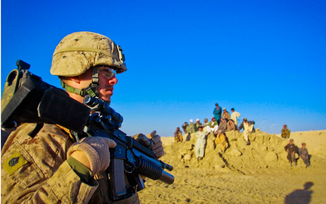 Staff Sgt.  Madalin L. Petre, platoon sergeant, 2nd Platoon, Combat Logistics Battalion 3, 1st Marine Logistics Group (Forward), provides security for a construction site near Combat Outpost Rankle, Afghanistan, Dec. 18.  Approximately 25 combat engineers and heavy equipment operators with CLB-3's Engineer Co. improved 1,100 meters of roadway in direct support of 2nd Battalion, 1st Marine Regiment as well as local Afghan citizens.