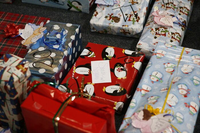 Presents with numbers lined the floor ready to be given away to each of the 51 children from the Yahata Children’s home that participated in the 6th annual Marine Corps Exchange angel tree gift exchange at the MCX here Dec. 18.