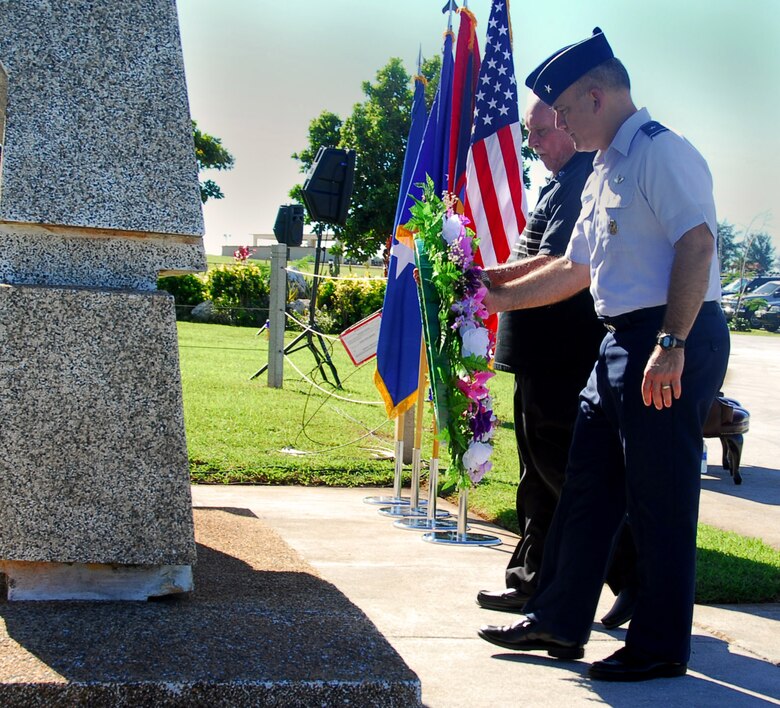 Brig. Gen. John Doucette, 36th Wing commander, and retired Lt. Col. Charles "Chuck" McManus, formerly a Strategic Air Command master navigator, lay a wreath during an Operation Linebacker ll memorial ceremony on Andersen Air Force Base, Guam, Dec. 17.  The Arc Light Memorial Park on the base stands as a memorial to the men and women of the Strategic Air Command who worked, flew, and died during the ARC LIGHT operations of the Vietnam War.  (U.S. Air Force photo/Staff Sgt. Jamie Powell)

