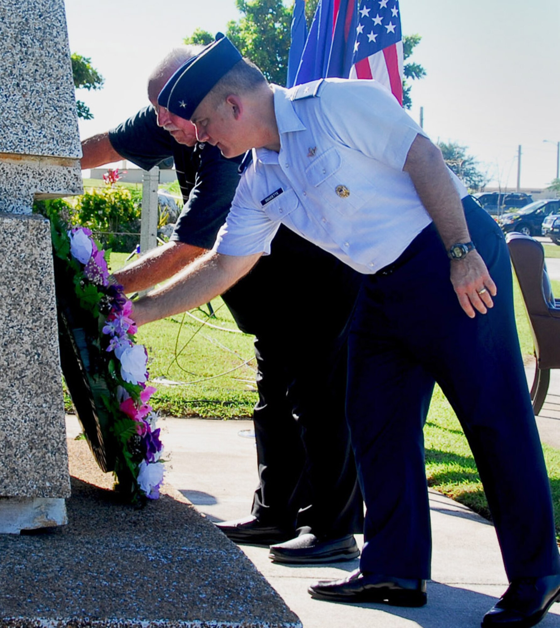 Brig. Gen. John Doucette, 36th Wing commander, and retired Lt. Col. Charles "Chuck" McManus, formerly a Strategic Air Command master navigator, lay a wreath during an Operation Linebacker ll memorial ceremony on Andersen Air Force Base, Guam, Dec. 17.  The Arc Light Memorial Park on the base stands as a memorial to the men and women of the Strategic Air Command who worked, flew, and died during the ARC LIGHT operations of the Vietnam War.  (U.S. Air Force photo/Staff Sgt. Jamie Powell)

