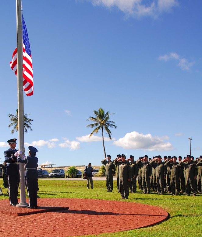 Team Andersen Airmen and audience members render a salute as Taps is played, in honor of the lives of 33 men and women that were lost during Operation Linebacker ll, at a memorial ceremony on Andersen Air Force Base, Guam, Dec. 17.  The ceremony commemorates the 38th anniversary of the campaign that led to the end of the Vietnam War.  (U.S. Air Force photo/Staff Sgt. Jamie Powell)