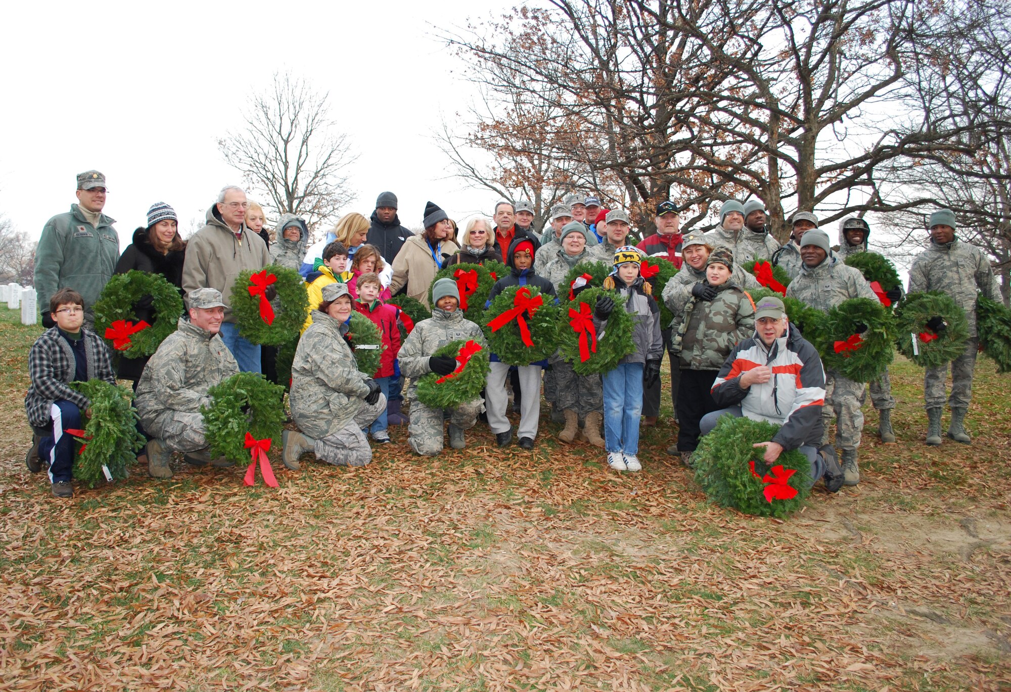 JOINT BASE MCGUIRE-DIX-LAKEHURST, N.J. -- Members of the 514th Air Mobility Wing and their families participate in the annual Wreaths Across America event held Dec. 11 at Arlington National Cemetery located in Arlington, Va. Volunteers placed wreaths on the headstones of fallen military veterans in honor of their memory. (U.S. Air Force photo/Senior Master Sgt. Chryl Ruff)