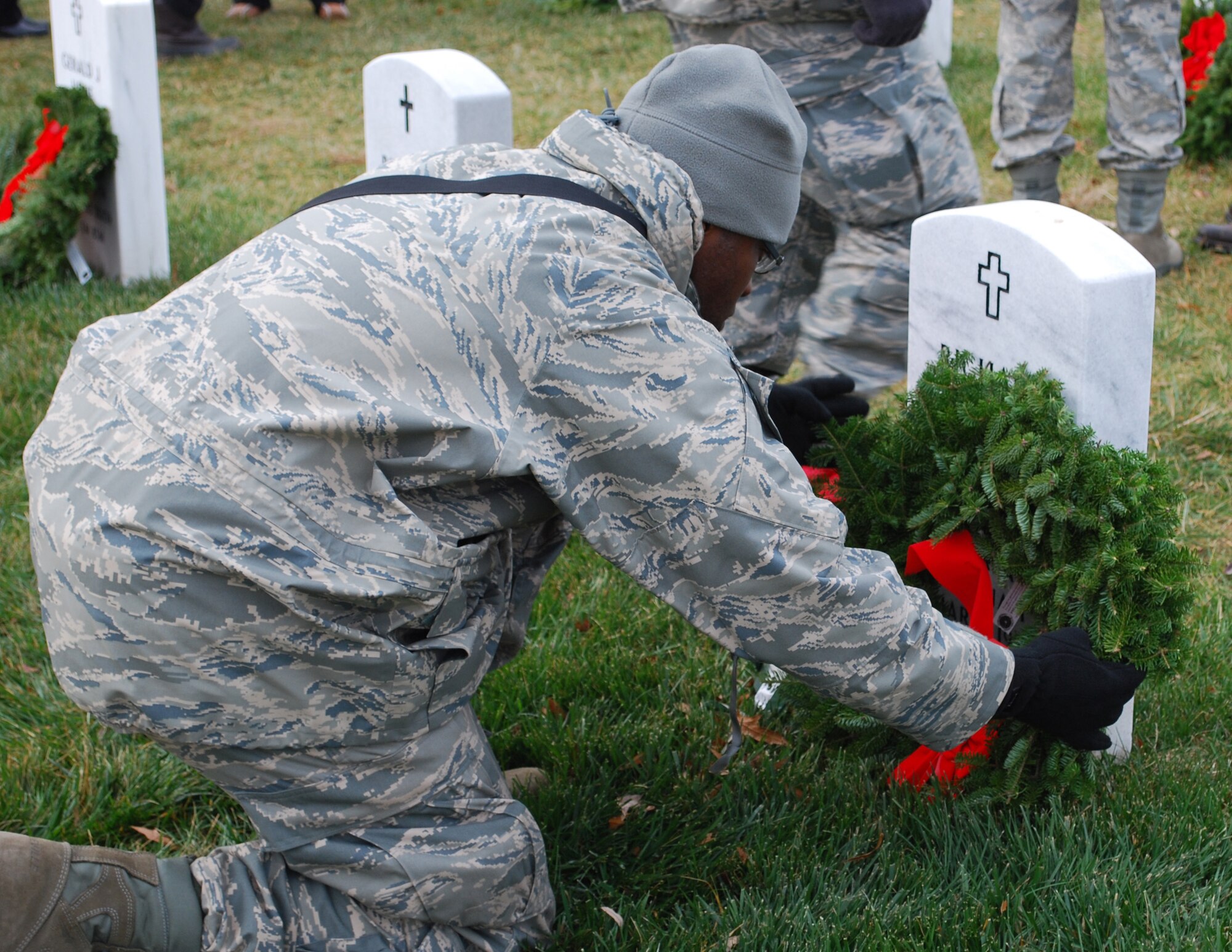 JOINT BASE MCGUIRE-DIX-LAKEHURST, N.J. -- Members of the 514th Air Mobility Wing participate in the annual Wreaths Across America event held Dec. 11 at Arlington National Cemetery located in Arlington, Va. Volunteers placed wreaths on the headstones of fallen military veterans in honor of their memory. (U.S. Air Force photo/Senior Master Sgt. Chryl Ruff)