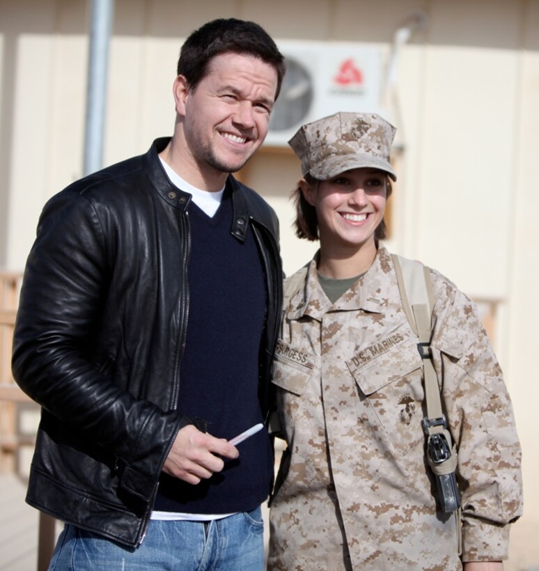 U.S. Marine Corps 2nd Lt. Rebecca Burgess, public affairs officer, 1st Marine Logistics Group (Forward), takes a photo with actor Mark Wahlberg during Wahlberg's visit to Camp Leatherneck, Afghanistan, Dec. 19. Wahlberg shook hands and took pictures with service members while thanking them for their service. More than 100 anxious fans waited in line to meet Wahlberg.