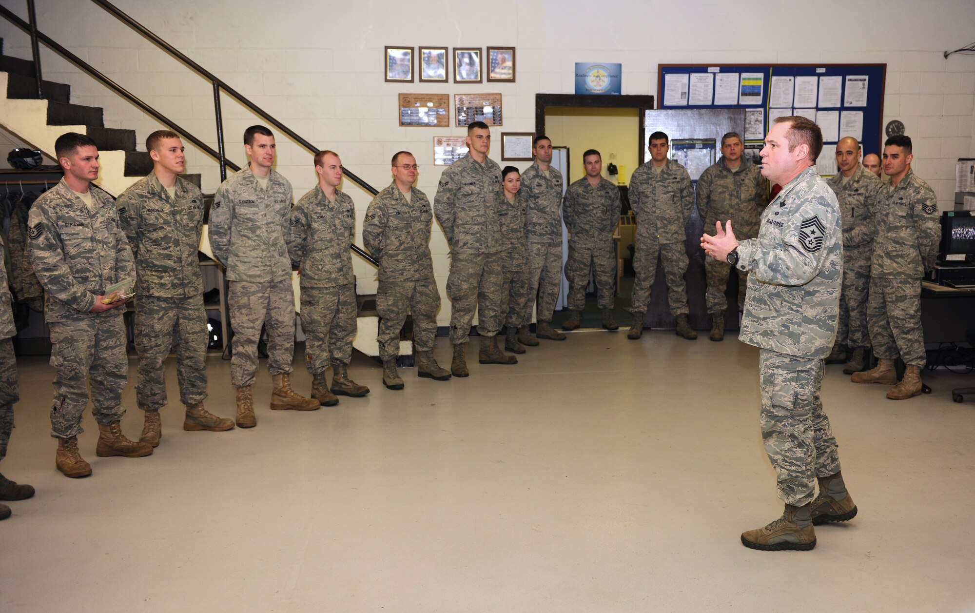 KUNSAN AIR BASE, Republic of Korea -- Chief Master Sgt. Tom Baker, 7th Air Force command chief, speaks to 8th Maintenance Squadron Airmen here Dec. 17, 2010. Col. John Costa, 7th Air Force chief of staff, Chief Baker, and their spouses visited the Wolf Pack for Cookie Crunch, where donated cookies were delivered to Airmen all over base at their work centers. (U.S. Air Force photo/Senior Airman Ciara Wymbs)  