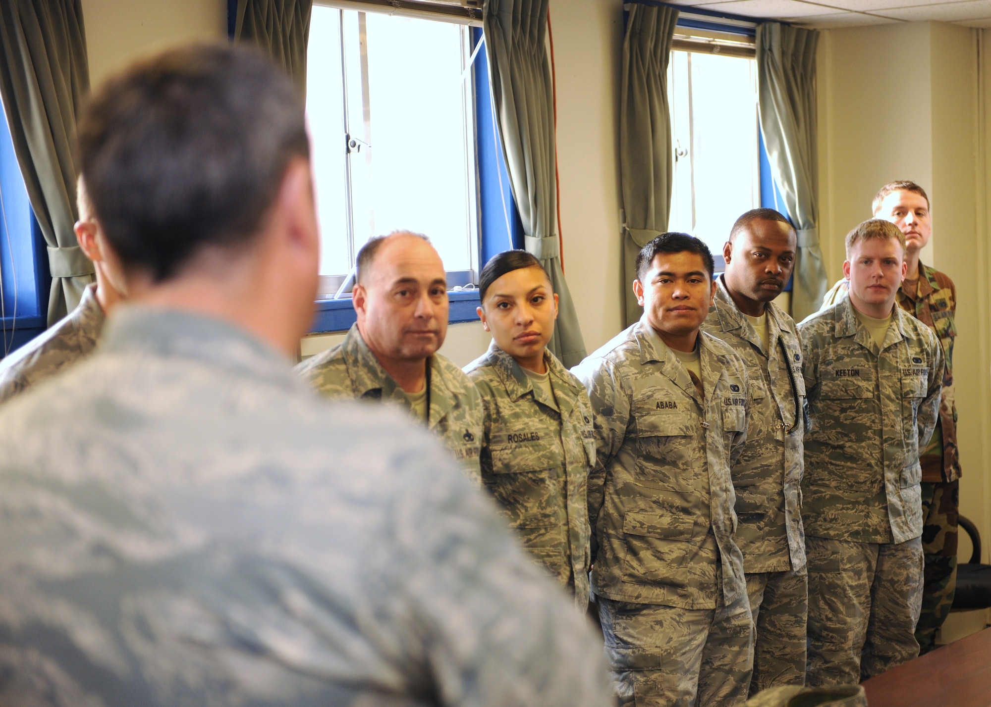 KUNSAN AIR BASE, Republic of Korea -- Col. John Costa, 7th Air Force chief of staff, speaks to Wolf Pack defenders here Dec. 17, 2010. Colonel Costa, Chief Master Sgt. Tom Baker, 7th Air Force command chief, and their spouses visited the Wolf Pack for Cookie Crunch, where donated cookies were delivered to Airmen all over base at their work centers. (U.S. Air Force photo/Senior Airman Ciara Wymbs)  