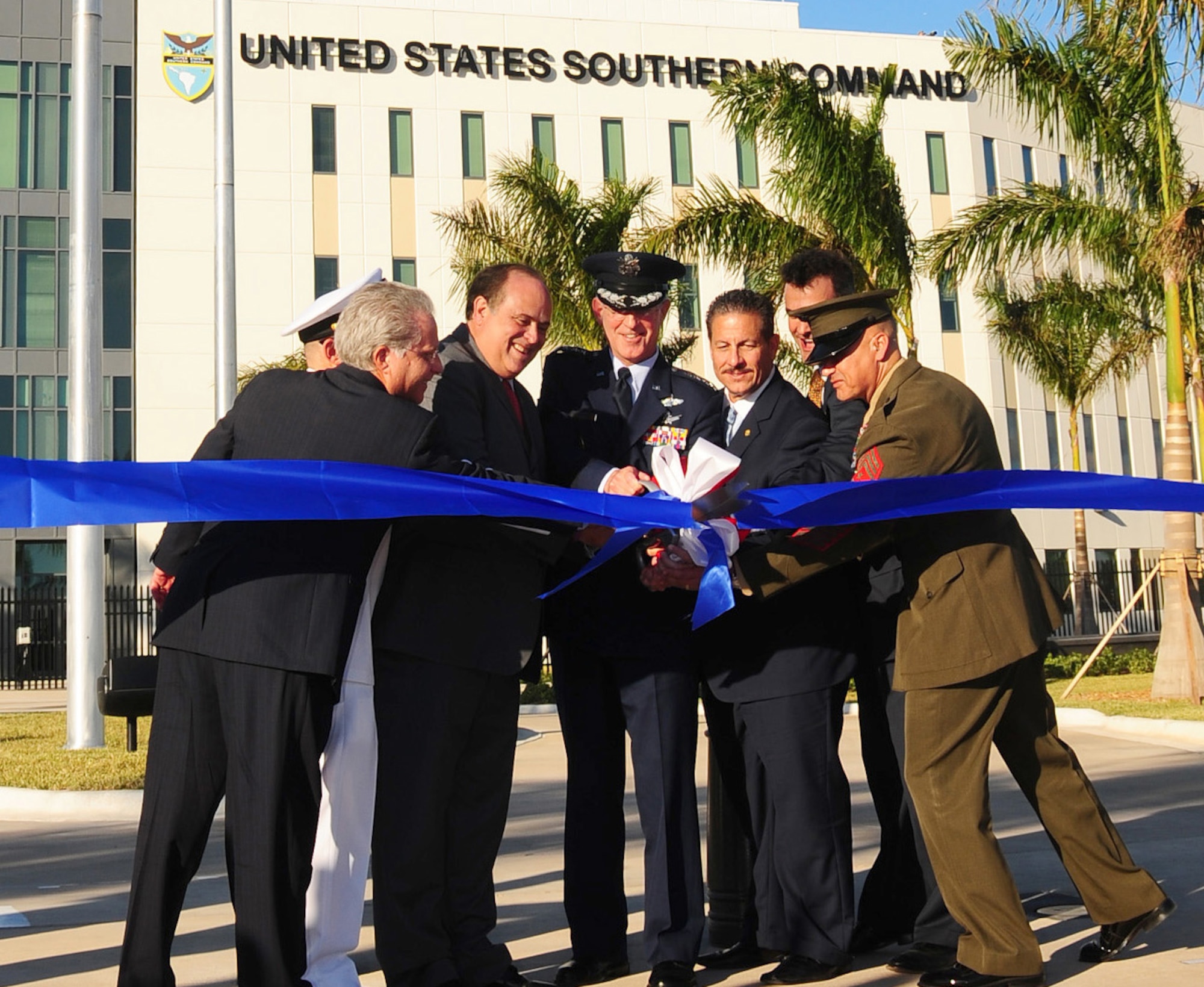 Air Force Gen. Douglas M. Fraser, along with military, civic and business leaders, cuts the ribbon that officially opens the new U.S. Southern Command headquarters in Doral, Fla. (U.S. Army photo by Juan Chiari)