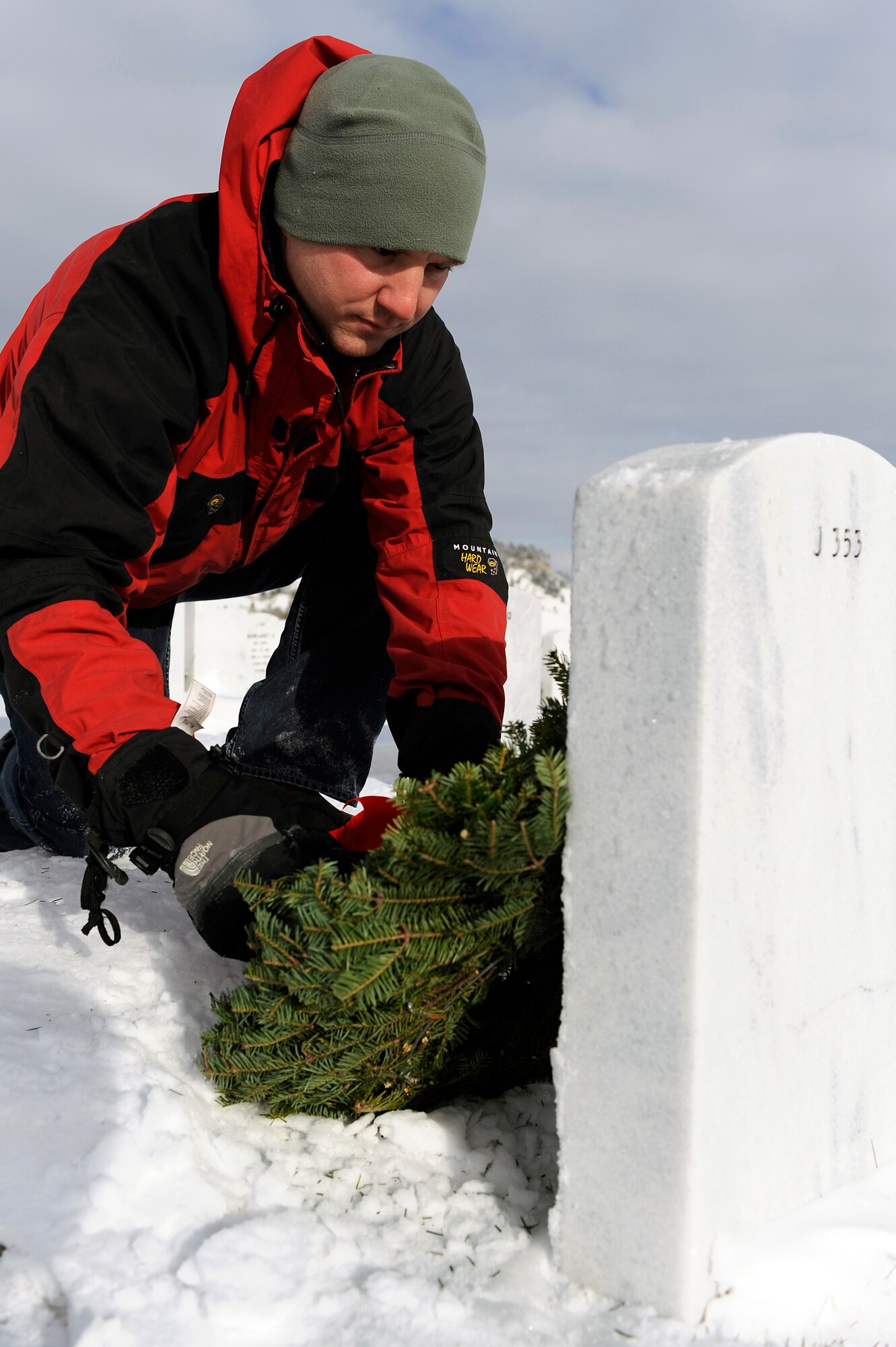 Tech. Sgt. Jody Haslip, 28th Medical Support Squadron NCO in charge of laboratory operations, lays a wreath on his father’s grave at the Black Hills National Cemetery, S.D., Dec. 11. Tech. Sgt. Haslip took part in the 2010 Wreaths Across America, an annual ceremony held to honor veterans by placing wreaths on their gravesite during the holidays. (U.S. Air Force photo/Staff Sgt. Marc I. Lane)