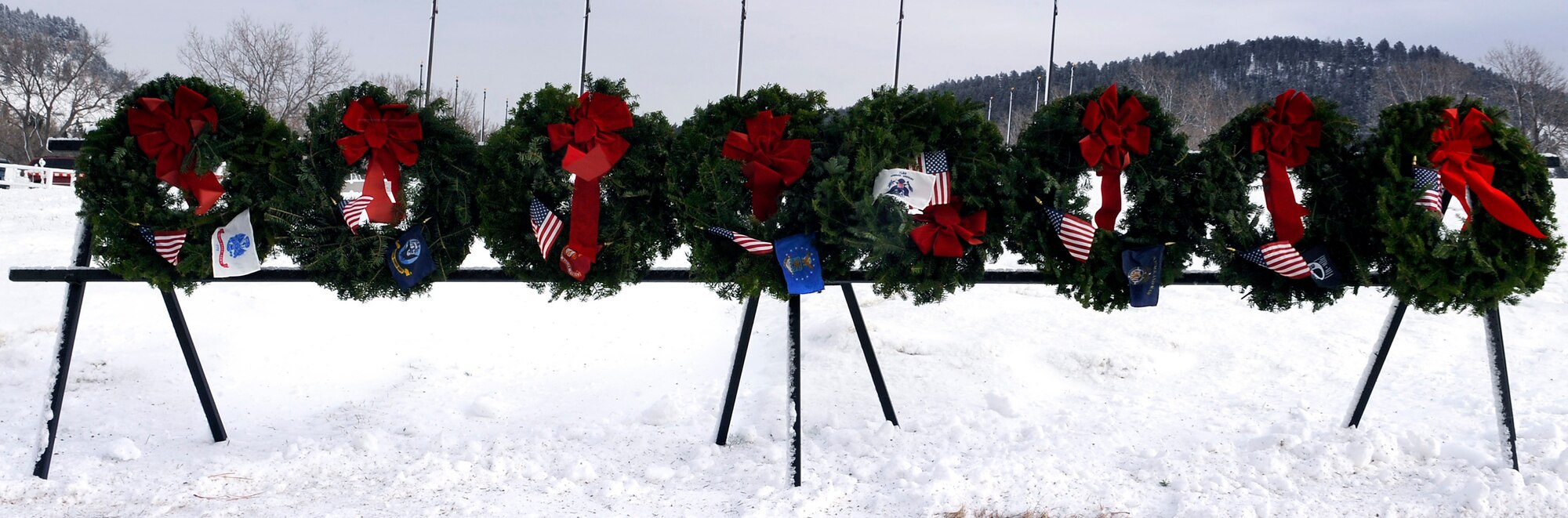 Seven ceremonial wreaths honor fallen heroes at the Black Hills National Cemetery, S.D., Dec. 11. The wreaths were among 250 laid by Wreaths Across America volunteers to honor fallen servicemembers. (U.S. Air Force photo/Staff Sgt. Marc I. Lane)