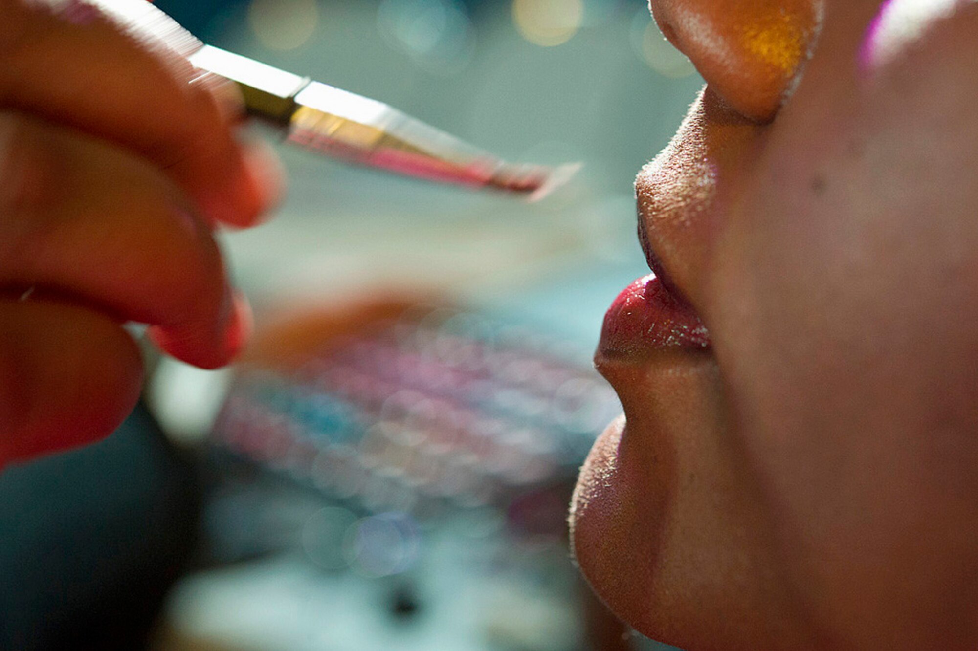 Staff Sgt. Rosalyn Moody has lip gloss applied Dec. 10, 2010, before a stage audition during the Tops in Blue Worldwide Talent Competition at Lackland Air Force Base, Texas. Sergeant Moody is a cargo processing supervisor from the 436th Aerial Port Squadron at Dover Air Force Base, Del. (Courtesy photo) 