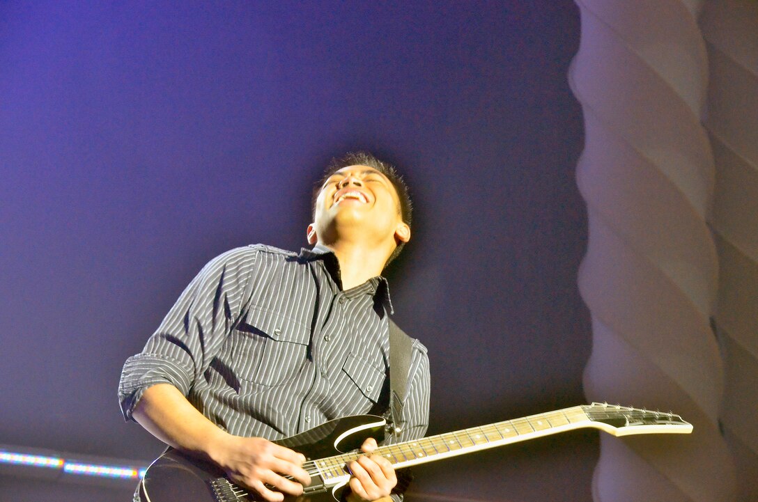 Airman 1st Class Jonathan Salvador performs an electric guitar solo Dec. 10, 2010, during the Tops in Blue Worldwide Talent Search at Lackland Air Force Base, Texas. Airman Salvador was named best in show and top musician for the competition that allows Airmen to audition for spots on the Tops In Blue team. Airman Salvador is assigned to Minot Air Force Base, N.D. (Courtesy photo) 