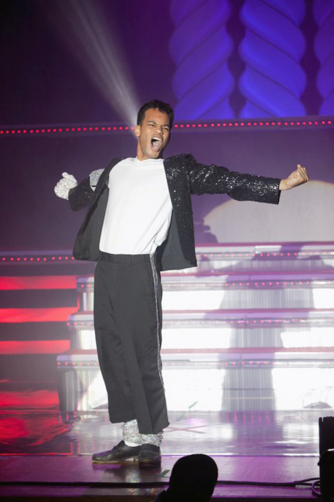 Staff Sgt. Tyron Jones strikes a famous Michael Jackson pose Dec. 12, 2010, during his dance performance at the Worldwide Talent Search at Lackland Air Force Base, Texas. Sergeant Jones is assigned to Osan Air Base, Korea. (Courtesy photo) 
