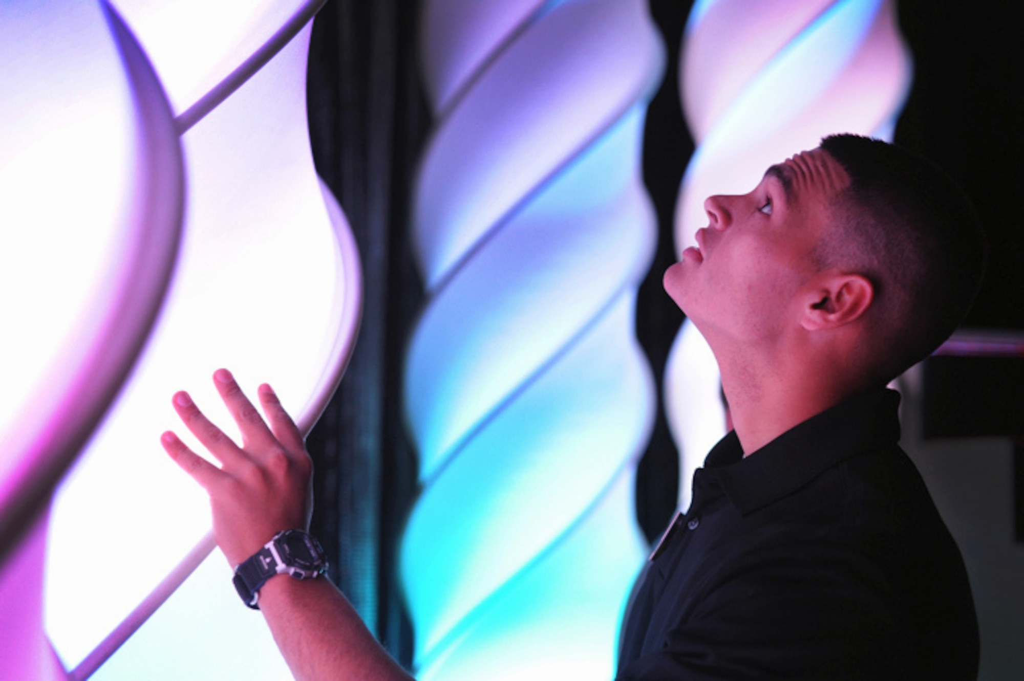 Senior Airman Jamie Ramirez, a ground radio journeyman from Beale Air Force Base, Calif., adjusts the stage lighting before the vocal auditions portion of the 2011 Tops in Blue worldwide auditions held at the Bob Hope Performing Arts Center, Lackland Air Force Base, Texas, Dec. 9, 2010. Airman Ramirez was responsible for aligning the 50-foot lighting fixtures on the stage in preparation for the final show. Technical team contestants are responsible for stage crew, lighting, and audio equipment during the 10-day audition. Airman Ramirez was named best technician for the competition. (U.S. Air Force photo/Staff Sgt. Vernon Young)