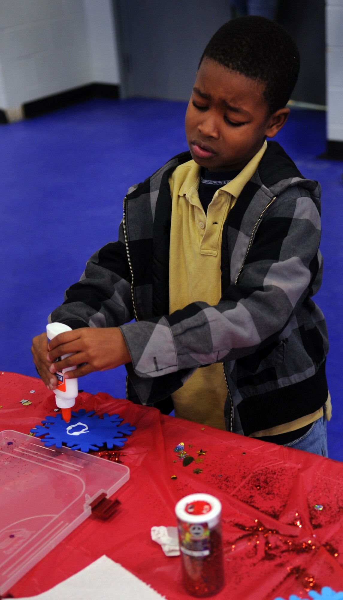 MOODY AIR FORCE BASE, Ga. -- Jadyn Ward decorates a snowflake during the Breakfast with Santa event at the Youth Center Dec. 18. Jadyn along with many other children made arts and crafts while waiting for Santa to arrive. (U.S. Air Force photo/Airman 1st Class Douglas Ellis)(RELEASED)