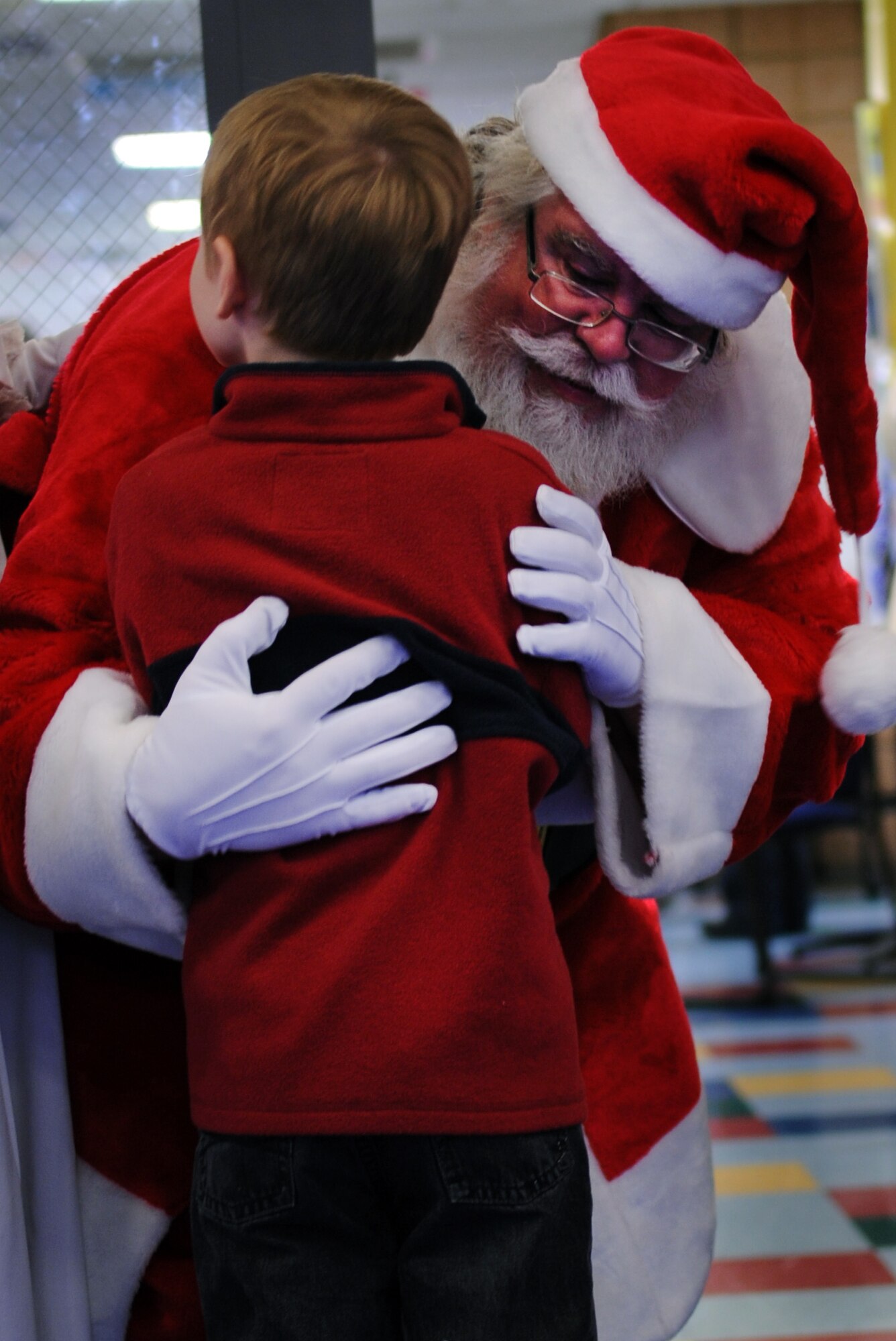 MOODY AIR FORCE BASE, Ga. -- Santa Claus hugs Noah Covel during the Breakfast with Santa event at the Youth Center Dec. 18. Noah and many other children waited in line to talk to Santa and tell him their Christmas wishes. (U.S. Air Force photo/Airman 1st Class Douglas Ellis)(RELEASED)
