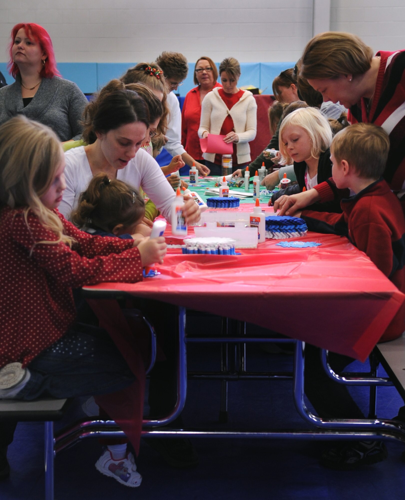 MOODY AIR FORCE BASE, Ga. -- Children and parents create snowflakes during the Breakfast with Santa event at the Youth Center Dec. 18. This event also included a visit by Santa Claus where children could sit on his lap and tell him their Christmas wishes. (U.S. Air Force photo/Airman 1st Class Douglas Ellis)(RELEASED) 
