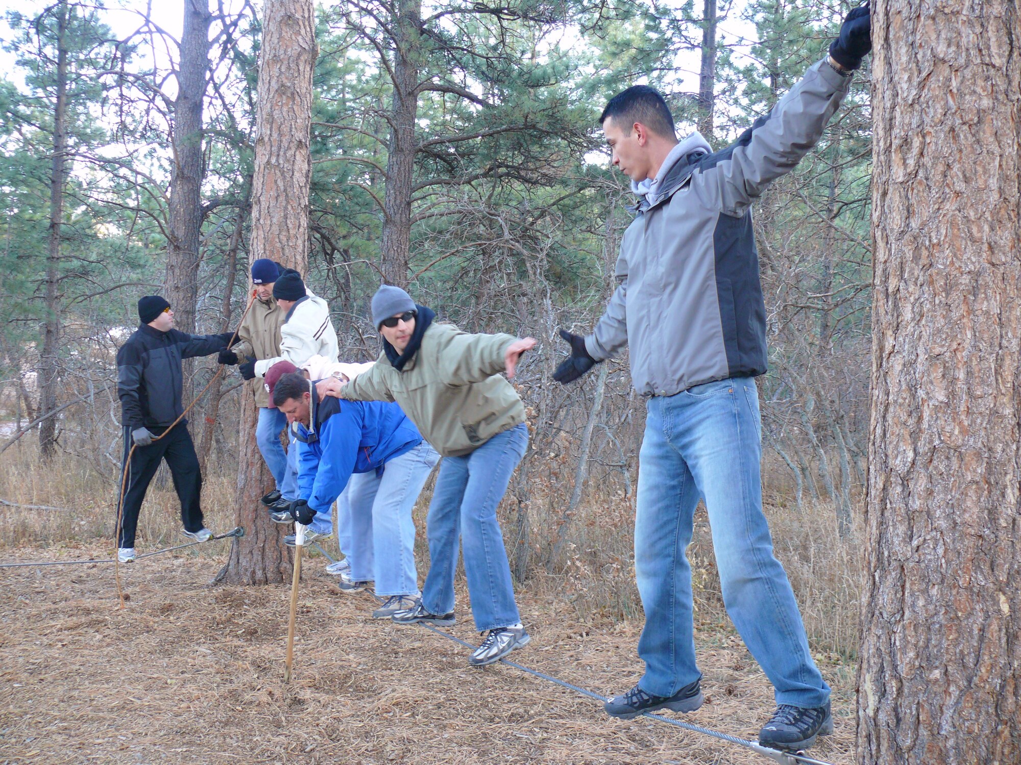 U.S. AIR FORCE ACADEMY, Colo. – Individuals from the 21st Operations Group GSU Training and Evaluation Conference Team participated in half-day activity at USAFA Responsible Officership Performance Enhancement Seminar Course Nov. 16 to 18. Two teams tackled several obstacles that demonstrate the challenging dynamics of team and interpersonal leadership. Respect and moral courage were modeled and tested as participants solved problems and accomplished the team exercises. The day finished with participants climbing the 65-foot tower. (U.S. Air Force photo)