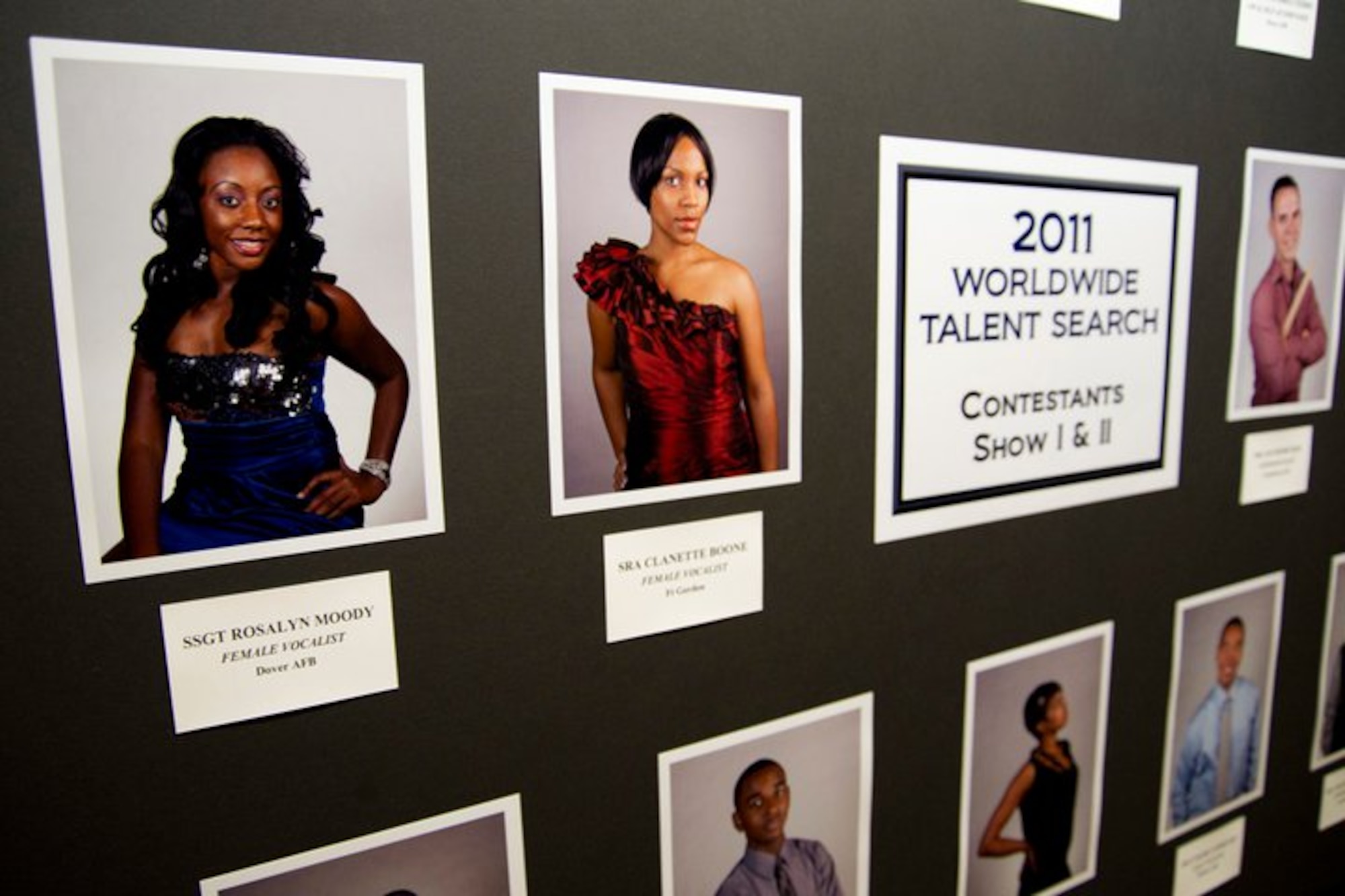 A picture of contestants from the first show night is displayed at the entrance of the Bob Hope Performing Arts Center at Lackland AFB, Texas, during the Tops in Blue Worldwide Talent Search on December 10, 2010. Senior Airman Clanette Boone (top center) was named the top female vocalist for the competition. (Courtesy Photo)
