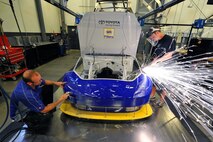 Members of the Michael Waltrip Racing Team show their skills in the backshop, but on Dec 17th they learned about the skills of Air Force reservists when they flew the 916th Air Refueling Wing. (Courtesy photo? 2010, autostock, USA)
Brian Czobat

