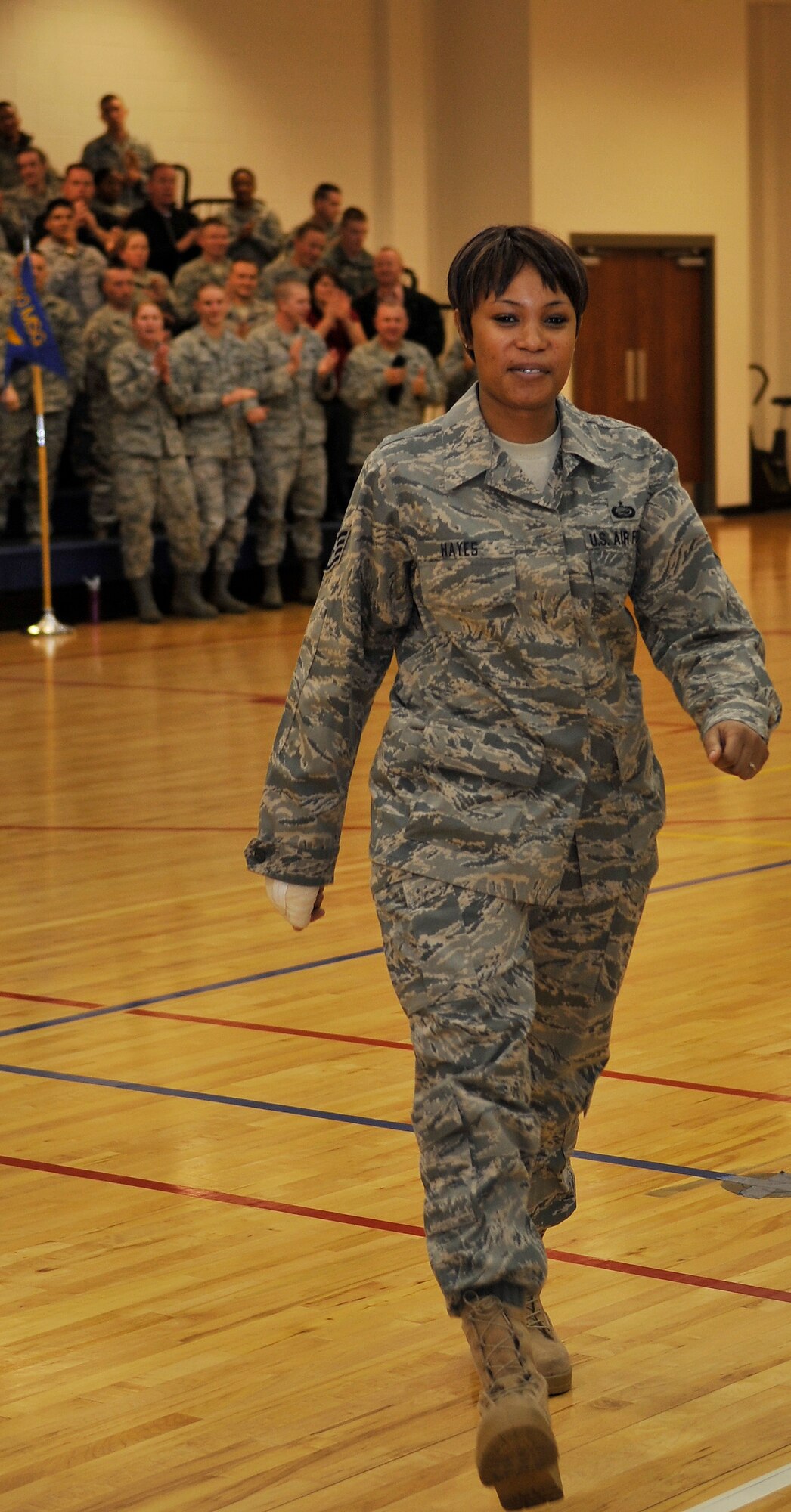 BUCKLEY AIR FORCE BASE, Colo. --  Recently promoted Tech. Sgt. Kandyse Hayes, 460th Force Support Squadron receives applause as she proceeds to receives her STEP promotion stripe on Dec. 16, 2010.(U.S. Air Force photo by Airman 1st Class Paul Labbe.)