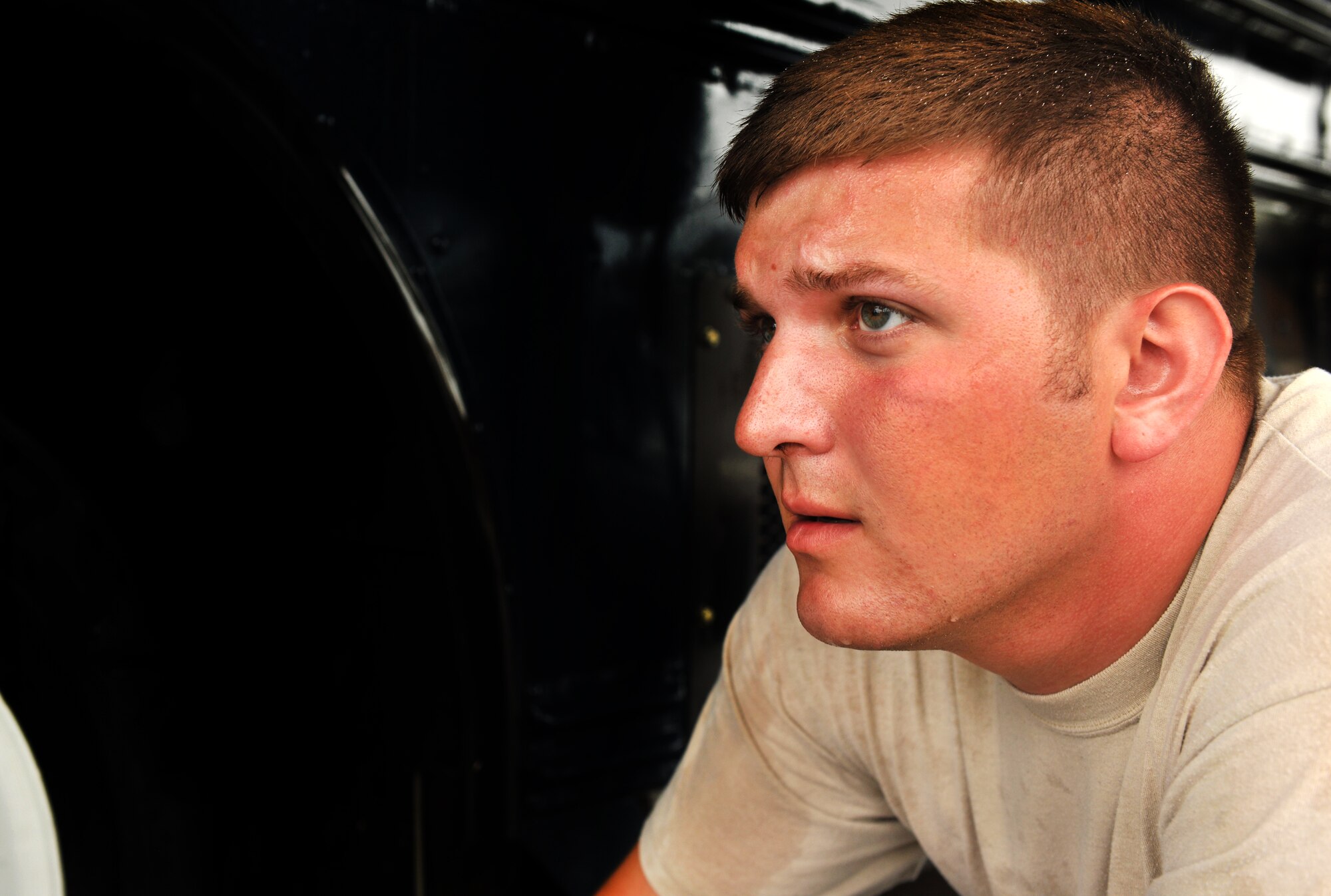 MOODY AIR FORCE BASE, Ga.-- Senior Airman John Schlict, 23rd Logistics Readiness Squadron vehicle operations flight journeyman, inspects for how well a bus was cleaned Nov. 24. Before a vehicle leaves the wash area, it is thoroughly inspected ensuring all standards were met. (U.S. Air Force photo/Airman 1st Class Joshua Green)(RELEASED)
