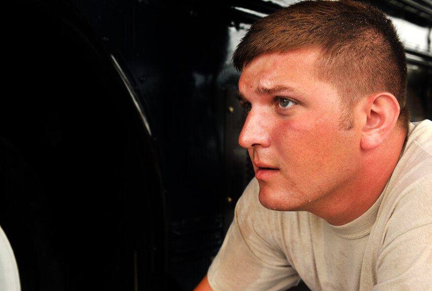 MOODY AIR FORCE BASE, Ga.-- Senior Airman John Schlict, 23rd Logistics Readiness Squadron vehicle operations flight journeyman, inspects for how well a bus was cleaned Nov. 24. Before a vehicle leaves the wash area, it is thoroughly inspected ensuring all standards were met. (U.S. Air Force photo/Airman 1st Class Joshua Green)(RELEASED)
