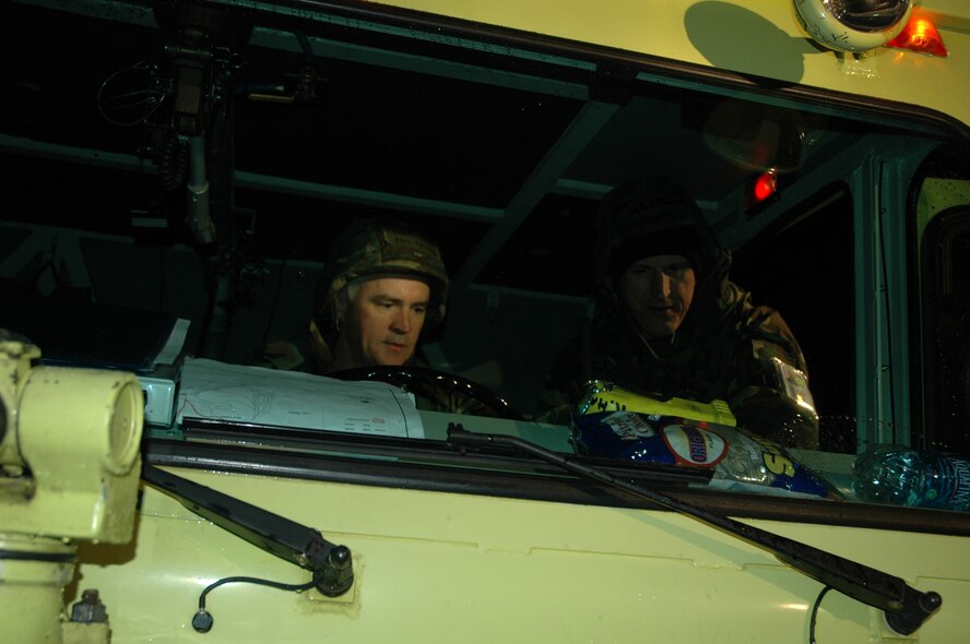 Col. Phil Fallin (left) gets a lesson on driving the fire truck at an inspection in 2006. The colonel, deputy commander of the 916th and tanker pilot, leaves the wing for Scott AFB in February. (USAF courtesy photo)