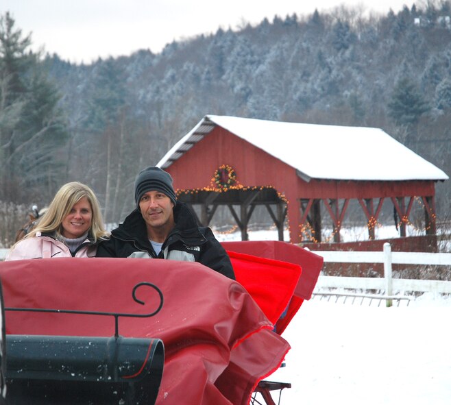 Tech. Sgt. David Aucoin, a reservist with the 42nd Aerial Port Squadron at Westover Air Reserve Base, and Tammy Rosa prepare for a sleigh ride Dec. 11 during a Yellow Ribbon Reintegration Program event at Stowe, Vt.  The three-day event included lectures from motivational speakers and time to relax.  Yellow Ribbon is part of a DoD-wide effort to help the 1.2 million National Guard and Reserve members and their families connect with the best resources available before, during, and after deployments. (US Air Force photo/Lt. Col. James Bishop)