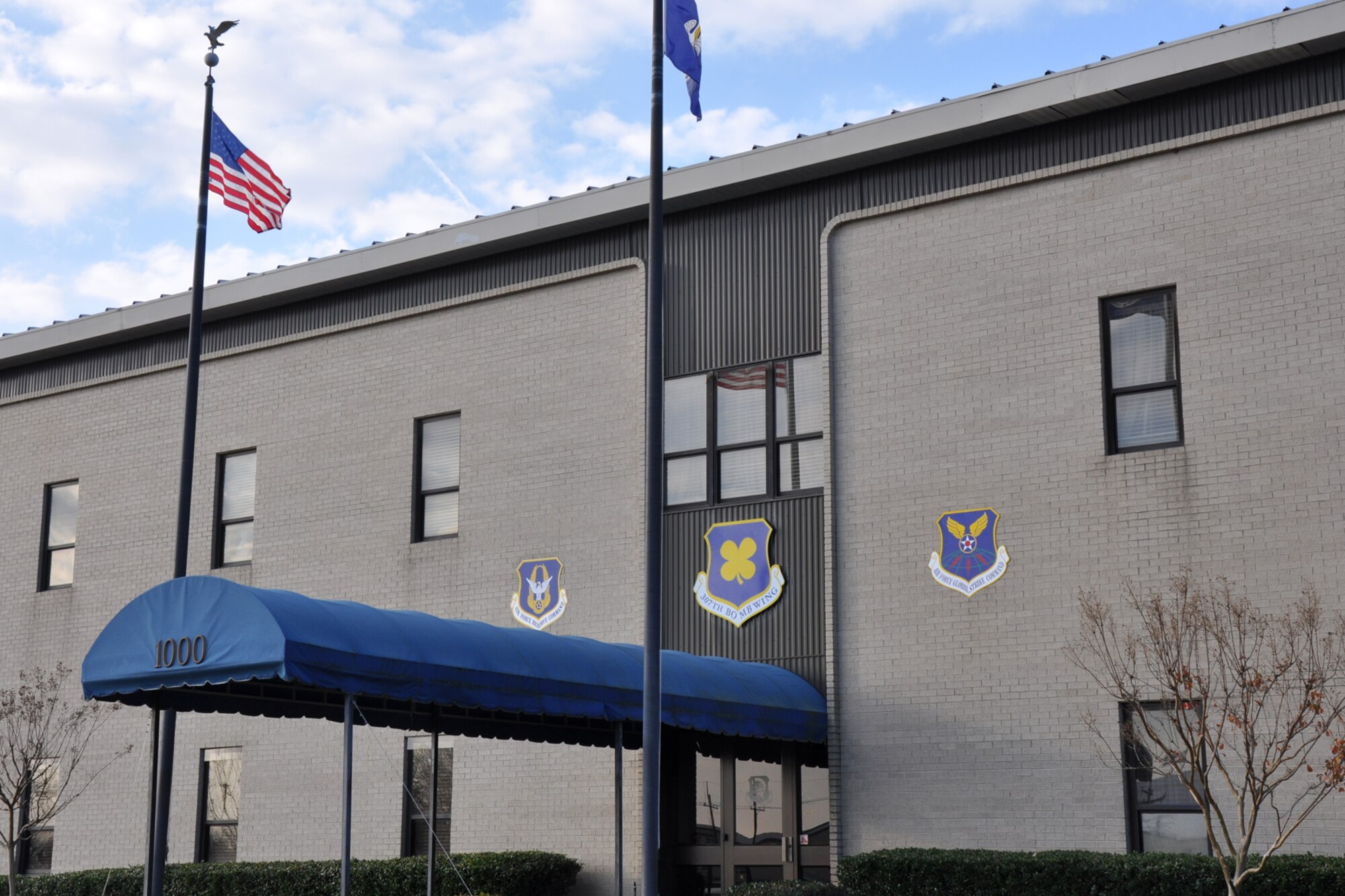 With new shields in place, the 917th Wing Headquarters building stands ready for future changes at Barksdale Air Force Base, La., Dec. 17, 2010. The 917th Wing is preparing to be deactivated, and the 307th Bomb Wing reactivated in ceremonies at Hoban Hall on Barksdale AFB, Jan. 8, 2011. In addition to those changes, the 917th Operations Group will be re-designated as the 917th Fighter Group in the same ceremonies. Although the equipment and personnel assigned to the 917 FG will remain at Barksdale, command and control for the unit will fall under the 442nd Fighter Wing at Whiteman Air Force Base, Mo. (U.S. Air Force photo /Tech. Sgt. Jeff Walston)

