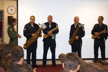 Col. Caroline Evernham (far left), 916th Operations Group commander, thanks members of the Air Force Heritage Band Saxophone Quartet for their holiday performance at the Reserve wing on Dec. 15, 2010. (USAF photo by Maj. Shannon Mann, 916ARW/PA)