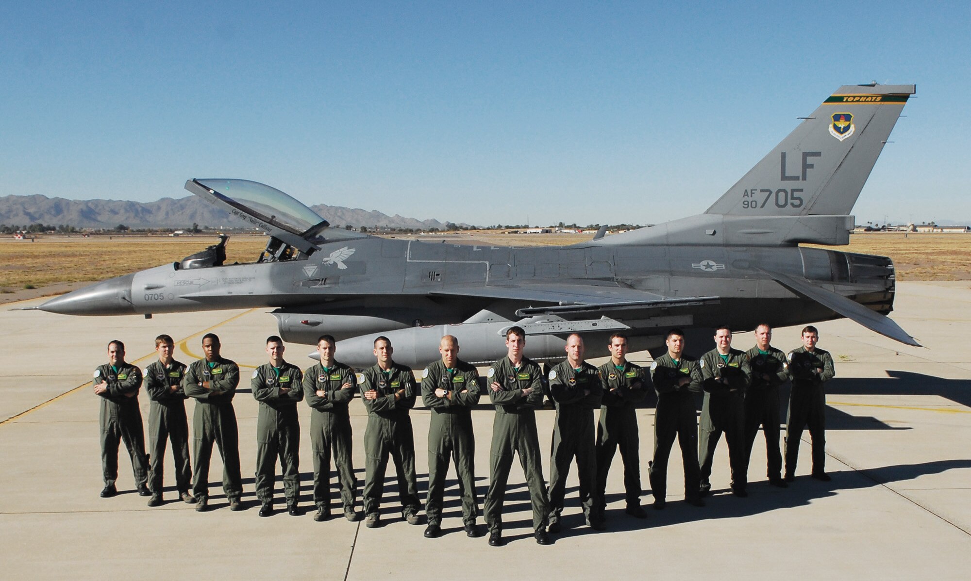 The 310th Fighter Squadron class 10-BBG graduates 14 pilots on January 7th.  FROM LEFT: Capts. Brady Marsh, Bryan Brandond, Jacob Coleman, Justin Lewis, Brent Choate, Joe Butters and Darin Docter; 1st Lt. John Powers; Capt. Dan Summers; 1st Lt. John Mann; Capts. Stanley Ruda III, Jonathan Ballard, Duncan McPhee, and Dustin Sanders.  (U.S. Air Force photo/Staff Sgt. Louis Vega Jr.)