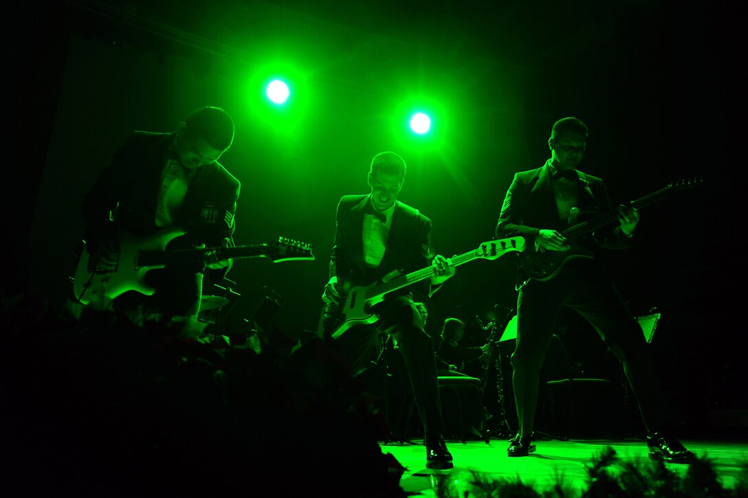 Staff Sgt. Santos, Airman First Class Kimble and Master Sgt. Baisden rock out on a tune from the movie Grinch.  This was part of the Heartland of America Band's annual holiday concert series held at the Holland Performing Arts Center in downtown Omaha, Neb.