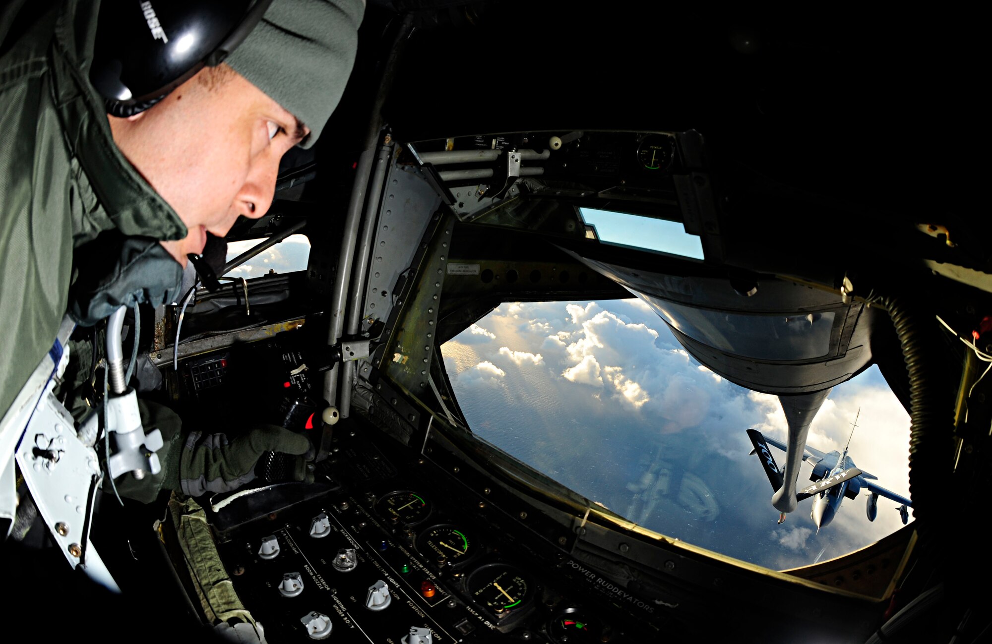 RAF MILDENHALL, England -- Staff Sgt. Roger Vula, 351st Air Refueling Squadron boom operator, passes gas to an RAF Tornado from RAF Lossiemouth, Scotland, Dec. 16, 2010. Sergeant Vula passed gas to a total of four Tornados during a training mission to prepare the RAF pilots for an upcoming deployment. (U.S. Air Force photo/Senior Airman Ethan Morgan)