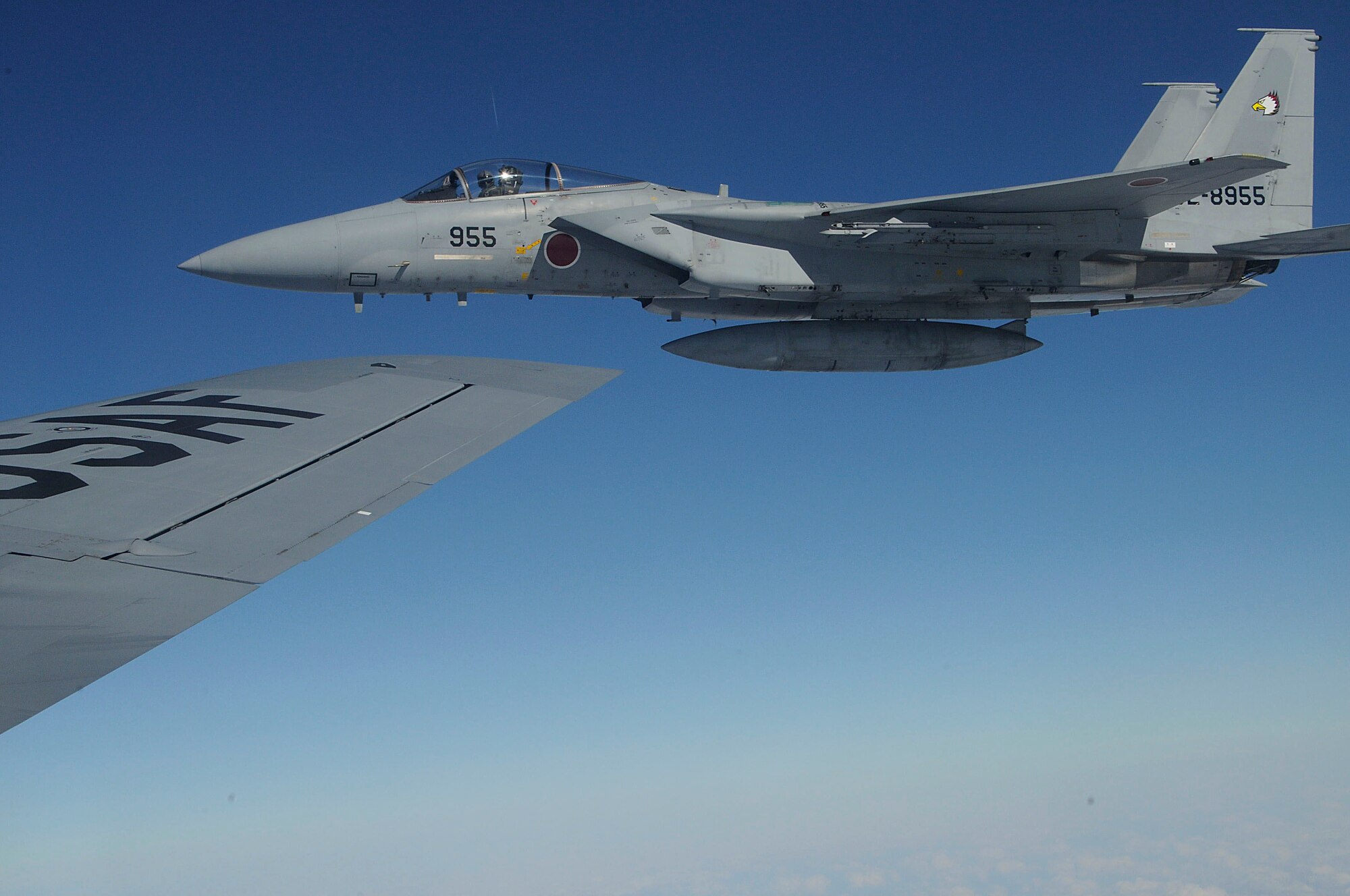 An F-15J flies through the air during the joint refueling training between the 909th Refueling Squadron and Japan Air Self Defense Forces, Dec. 17. This training improved biliteral relationships between the 18th Wing and JASDF members. (U.S. Air Force photo/Staff Sgt. Darnell T. Cannady)