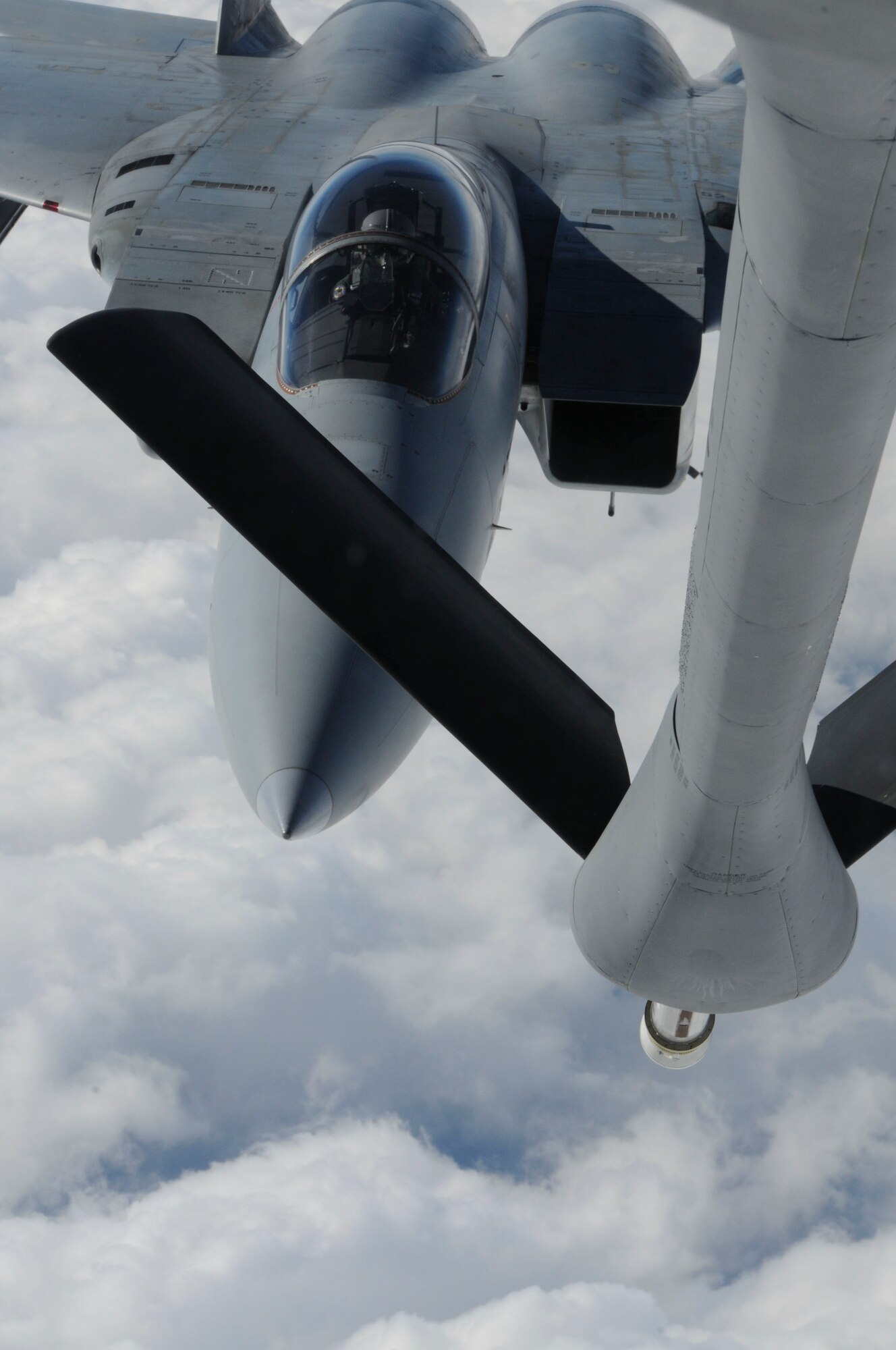 An F-15J connects to the boom of the KC-135 during the joint refueling training between the 909th Refueling Squadron and Japan Air Self Defense Forces, Dec. 17. This training improved bilateral relationships between the 18th Wing and JASDF members. (U.S. Air Force photo/Staff Sgt. Darnell T. Cannady)