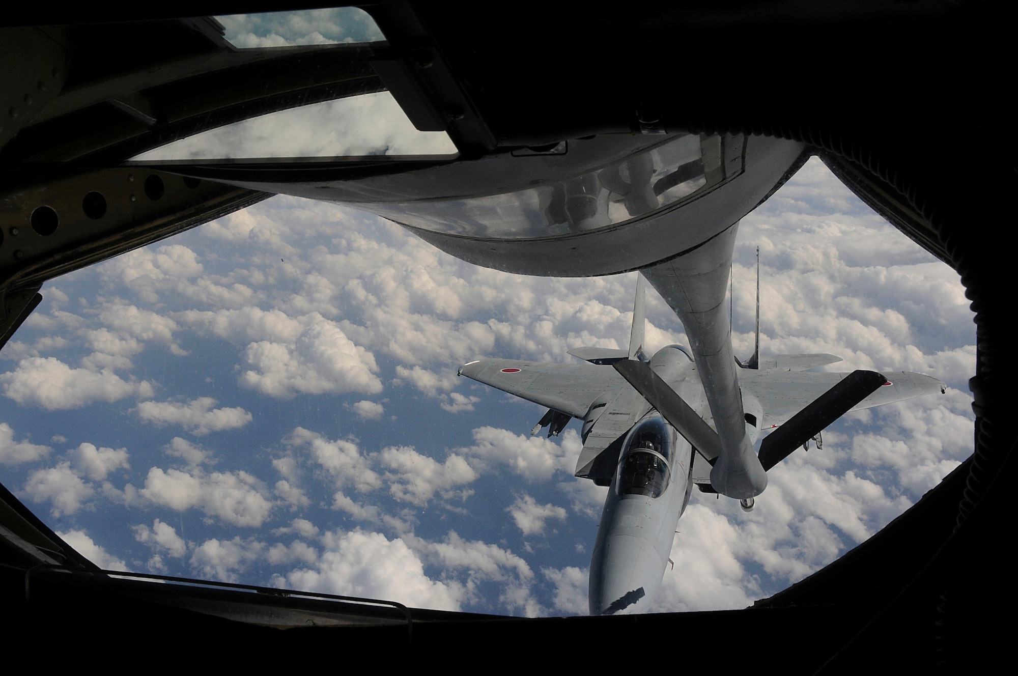 An F-15J connects to the boom of a KC-135 during the joint refueling training between the 909th Refueling Squadron and Japan Air Self Defense Forces, Dec. 17. This training allowed U.S. and Japanese forces to train on refueling procedures. (U.S. Air Force photo/Staff Sgt. Darnell T. Cannady)