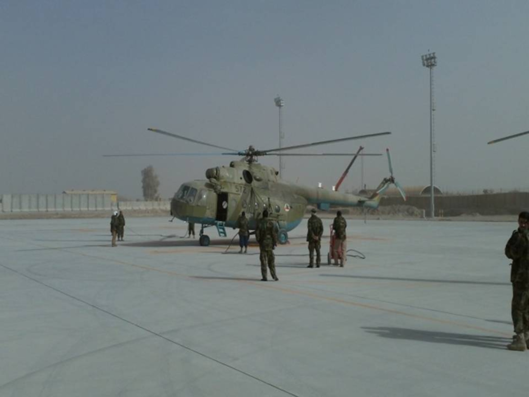 Kandahar Air Wing personnel and NATO Air Training Command-Afghanistan complete the first 200 hour maintenance phase inspection on the Mi-17/572 helicopter. (Photo by U.S. Air Force/Released).