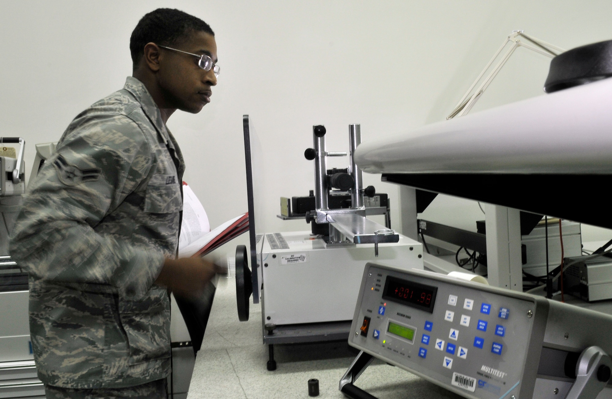 U.S. Air Force Airman 1st Class Reginald Lesane, 35th Maintenance Squadron Precision Measurement Equipment Laboratory technician, tests a torque wrench to verify the accuracy of its gauge Dec. 20, 2010 Misawa Air Base, Japan. PMEL tests and ensures the accuracy of more than 4,200 pieces of equipment. (U.S. Air Force photo by Tech. Sgt. Phillip Butterfield/Released)