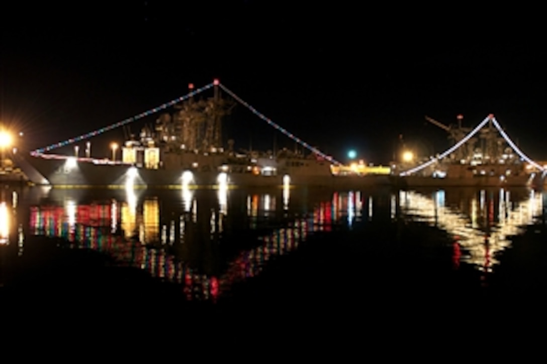The guided-missile frigates USS Underwood (FFG 36) and USS Halyburton (FFG 40) are decorated with lights for a holiday lighting contest at Naval Station Mayport, Fla., on Dec. 15, 2010.  
