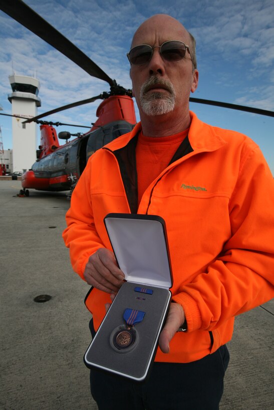 Lavon J. Vance, the Visiting Aircraft Line supervisor for Cherry Point’s Airfield Operations Department, holds the Meritorious Civilian Service Medal he received Dec. 17 for his exceptional leadership during the 2010 air show “Semper Fi over the Carolina Sky.” Vance, a retired gunnery sergeant, once served as a crew chief for Marine Transport Squadron 1 and now leads eight Marines and 18 civilians in his current position at the Airfield Operations Department.