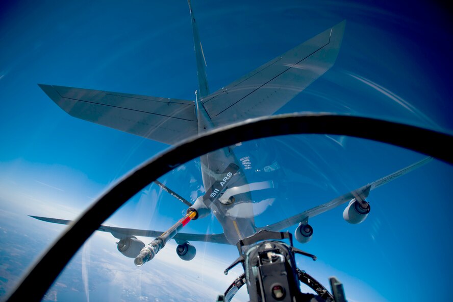 From the pilot's viewpoint, an F-15E Strike Eagle positions under the boom of a KC-135R Stratotanker during a training mission Dec. 17, 2010, over North Carolina. The F-15E is from the 335th Fighter Squadron from Seymour Johnson Air Force Base, N.C. (U.S. Air Force photo/Staff Sgt. Michael B. Keller)