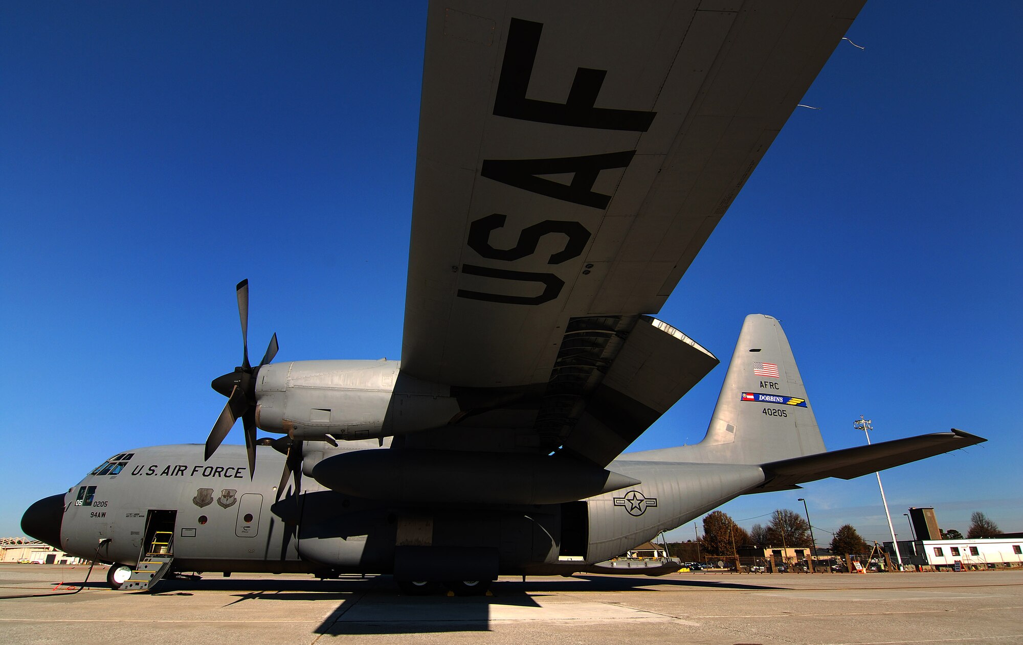 The view under the left wing of a Dobbins Air Reserve Base C-130H2 Hercules, Dec 20.  The wingspan of the 94th Airlift Wing aircraft is 132 feet, 7 inches.  (U.S. Air Force photo/ Brad Fallin)