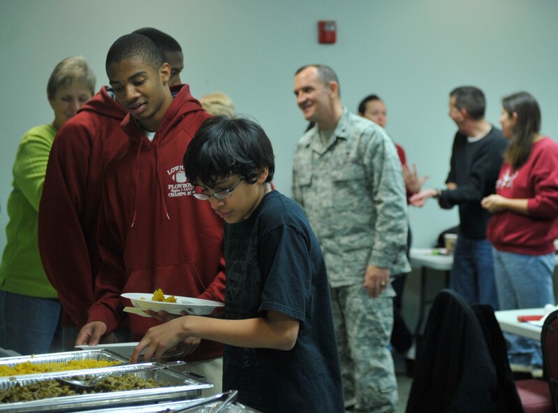 MOODY AIR FORCE BASE, Ga.-- Holiday dinner was served to the carolers and dorm residents at the chapel Dec. 8. Instead of having the weekly bible study, the group of adults and children went through the dorms caroling and inviting people back to the chapel for dinner. (U.S. Air Force photo/Airman 1st Class Nicholas Benrot (RELEASED)