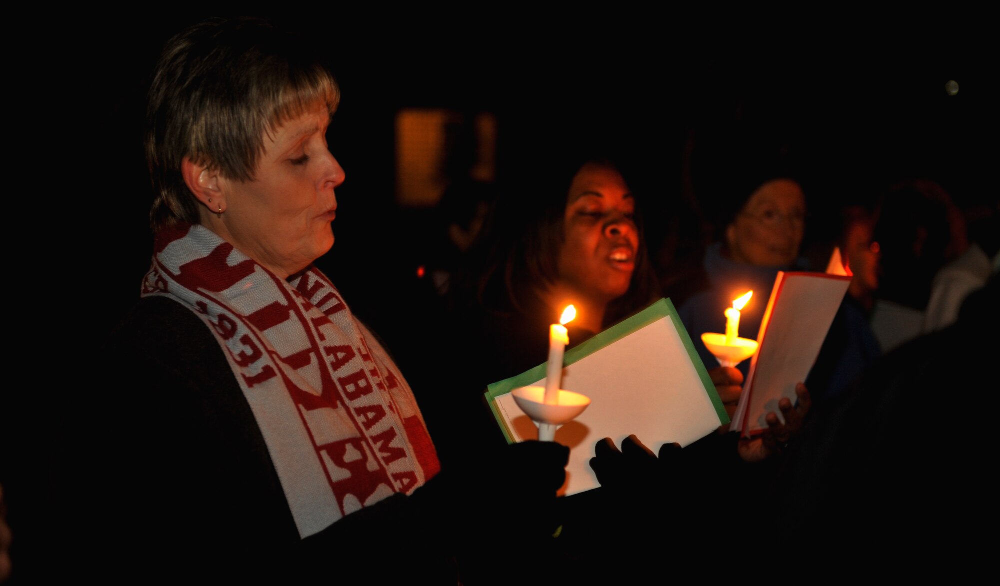 MOODY AIR FORCE BASE, Ga.-- Service members, dependents and retirees gather together to sing holiday carols throughout the dorms Dec. 8. The carolers went to dorms on base to sing to the Airman and invite them to a holiday dinner held at the chapel. (U.S. Air Force photo/Airman 1st Class Nicholas Benroth)(RELEASED)