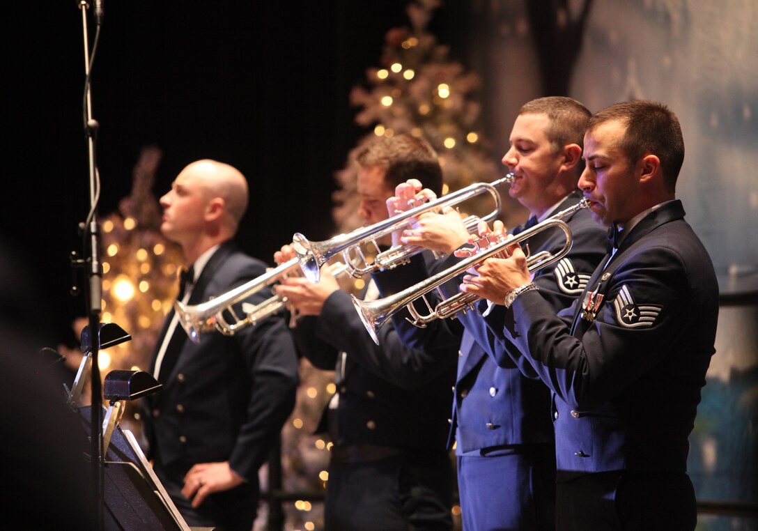 Trumpets SSgt Dave Evans, SSgt Shane Kibbey, SrA Jason Smith and A1C Ken Jones perform with Dimensions in Blue during the 2010 production of Holiday in Blue.