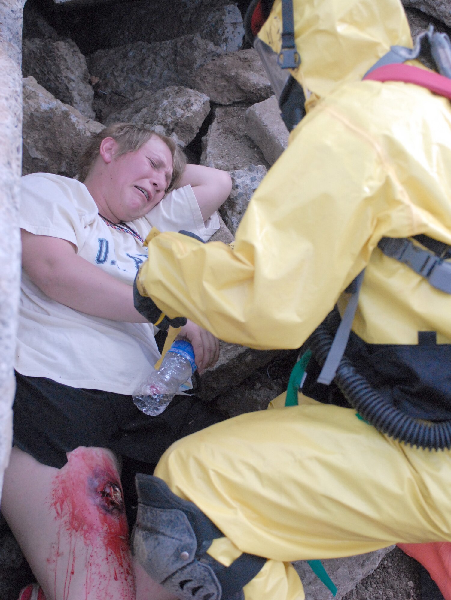 Hawaii National Guardsmen assist "victims" of a simulated dirty bomb detonation Dec. 16, 2010, at Bellows Air Force Station, Hawaii, during a homeland defense response validation exercise. (U.S. Air Force photo/Staff Sgt. Carolyn Viss)